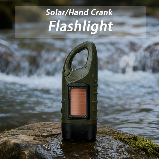 Hand crank solar flashlight on an outdoor rock